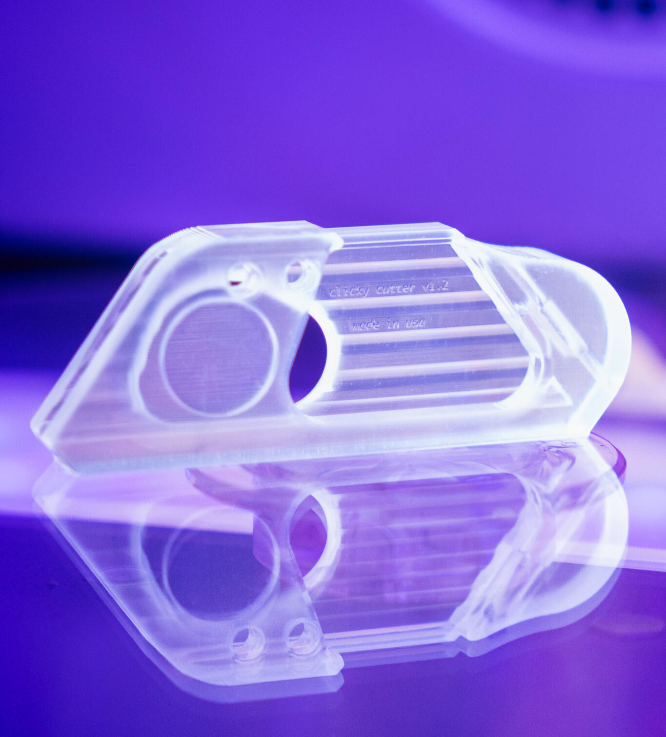 Clicky Cutter compact retractable box cutter on reflective surface